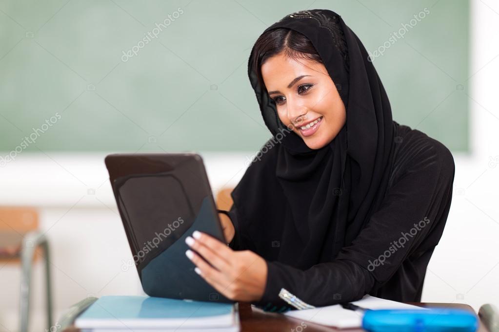 Arabian teen girl using tablet computer