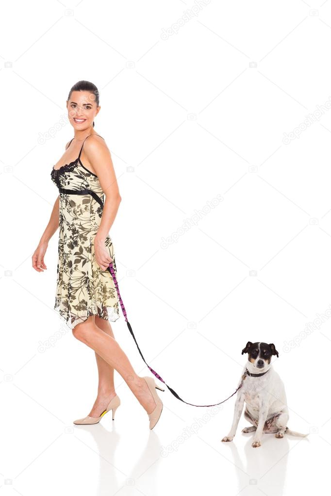pretty woman walking with dog