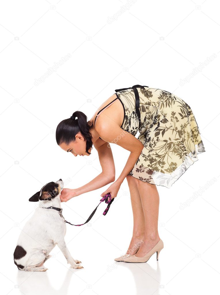 caring pet owner playing with her dog