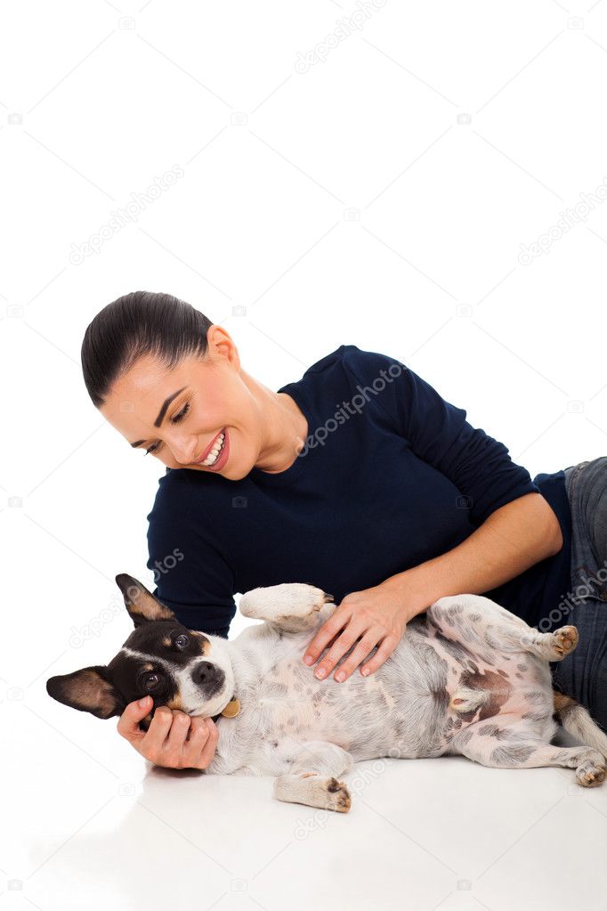 happy woman playing with her pet dog