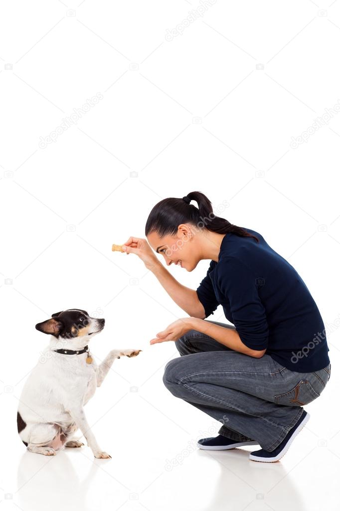 young woman training her dog