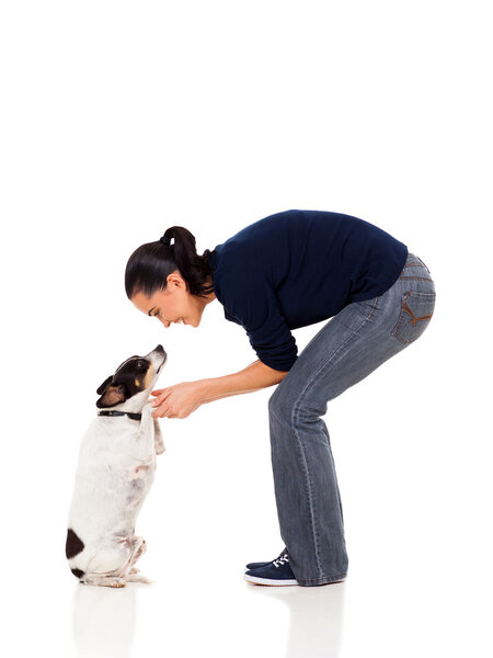 caring woman playing with her dog