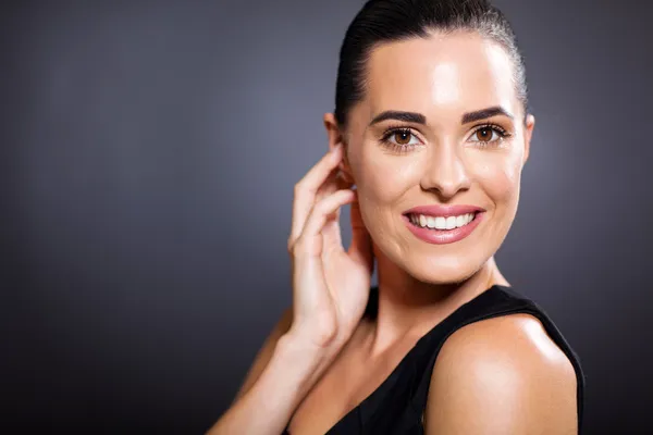 Smiling woman on black — Stock Photo, Image