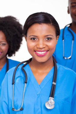 female nurse with colleagues on background