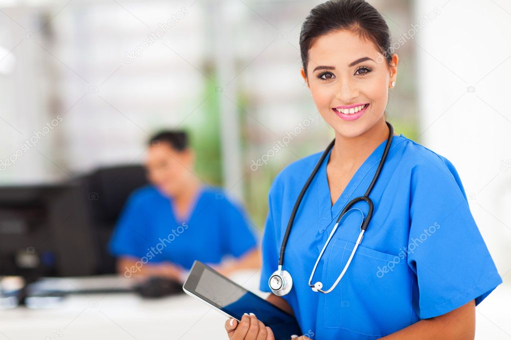 female nurse holding tablet computer