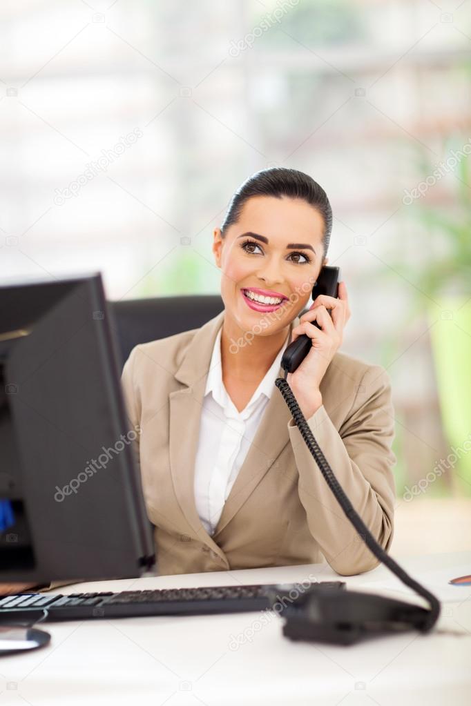 business woman answering telephone