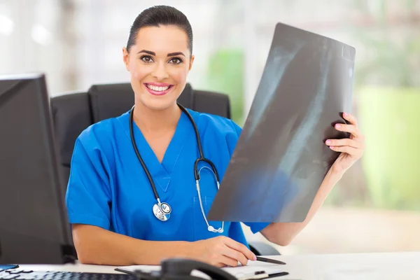 Female medical doctor with a an x-ray — Stock Photo, Image