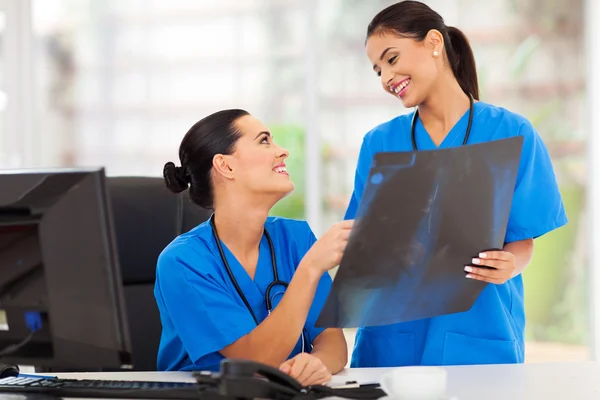 Medical doctors discussing over x-ray — Stock Photo, Image