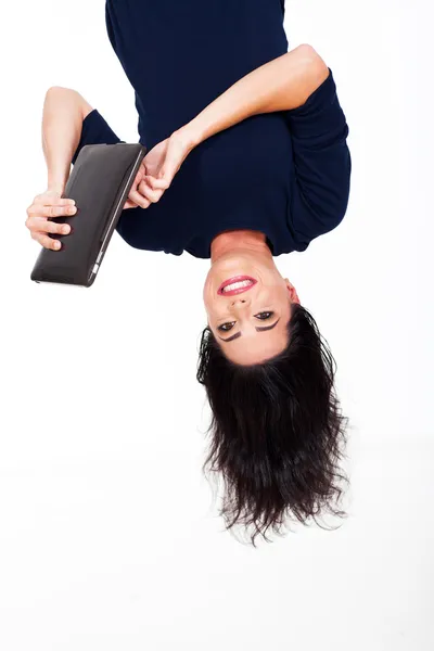 Fun woman using tablet computer upside down — Stock Photo, Image