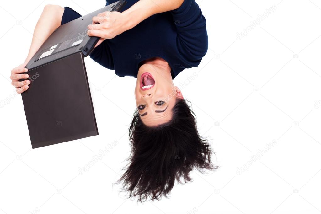 girl using laptop computer upside down