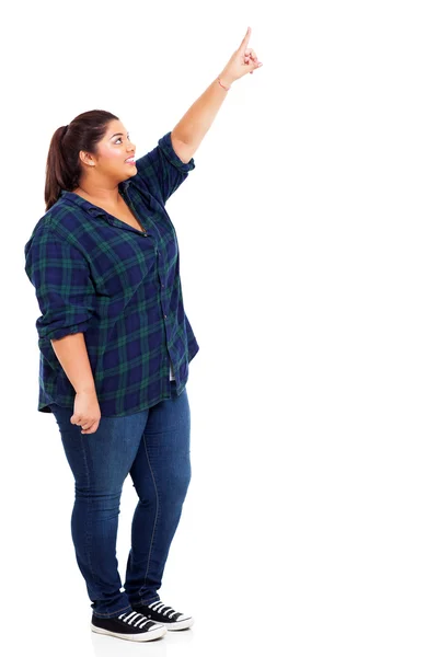 Glückliche Frau zeigt nach oben — Stockfoto