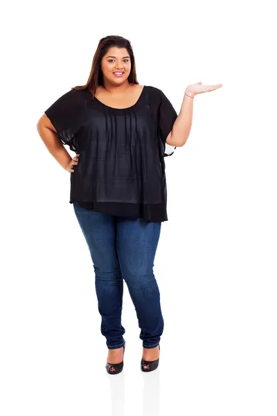 Lovely plus size woman presenting Royalty Free Stock Photos