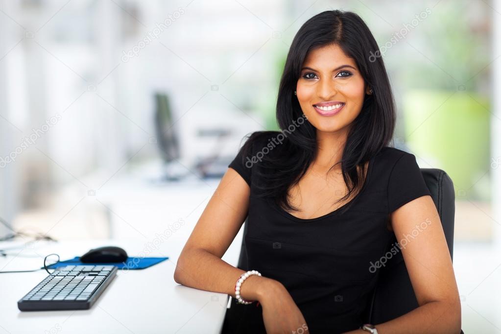 lovely young businesswoman sitting in office