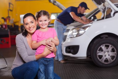 mother and daughter in garage