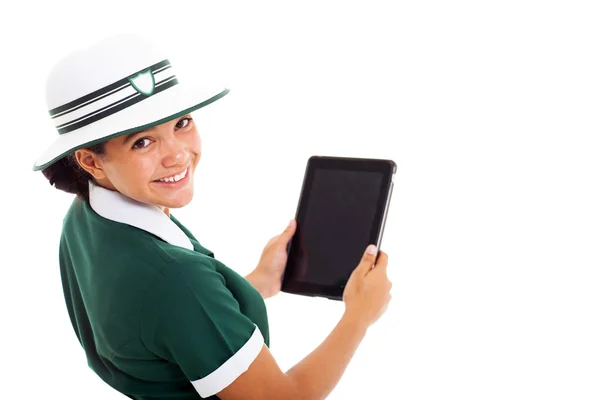 Schoolgirl looking back holding tablet computer — Stock Photo, Image