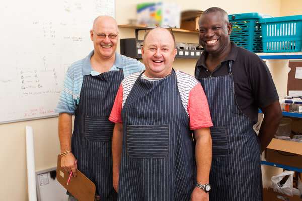 senior small business owner and employees