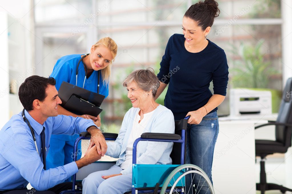 male doctor comforting senior patient