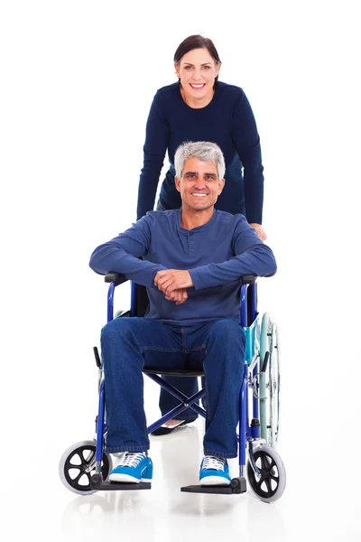 Średniej wieku kobieta z niepełnosprawnym mężem — Zdjęcie stockowe