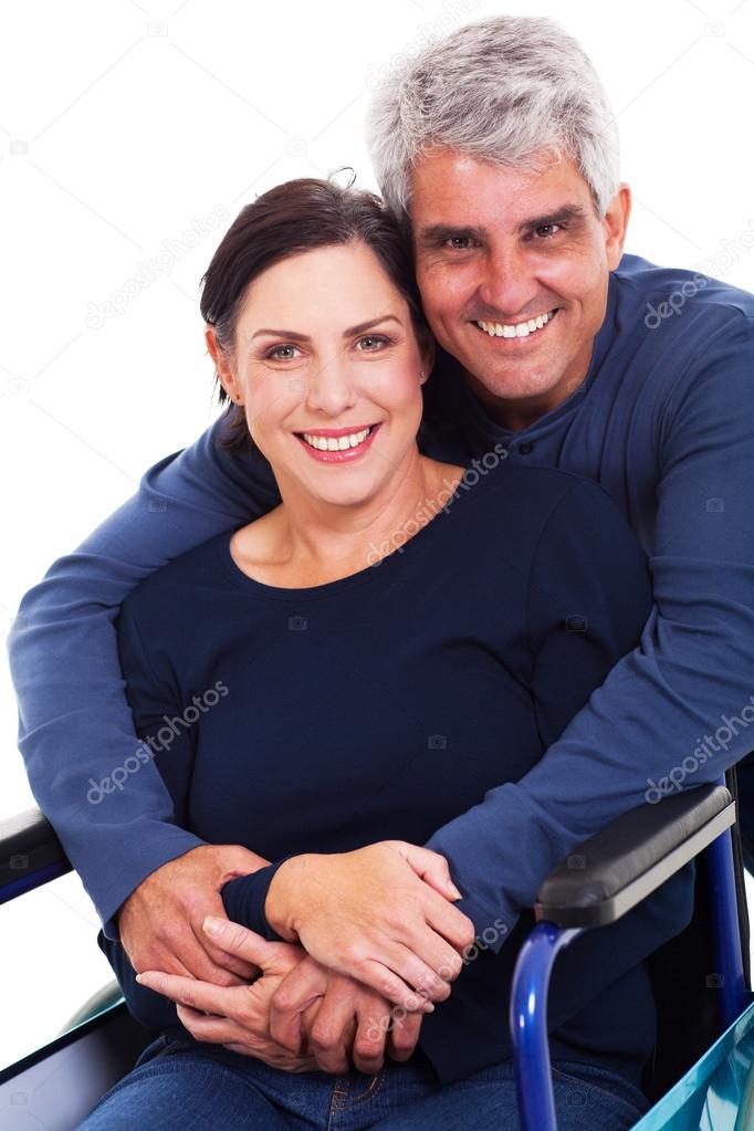 loving supportive husband hugging disabled wife