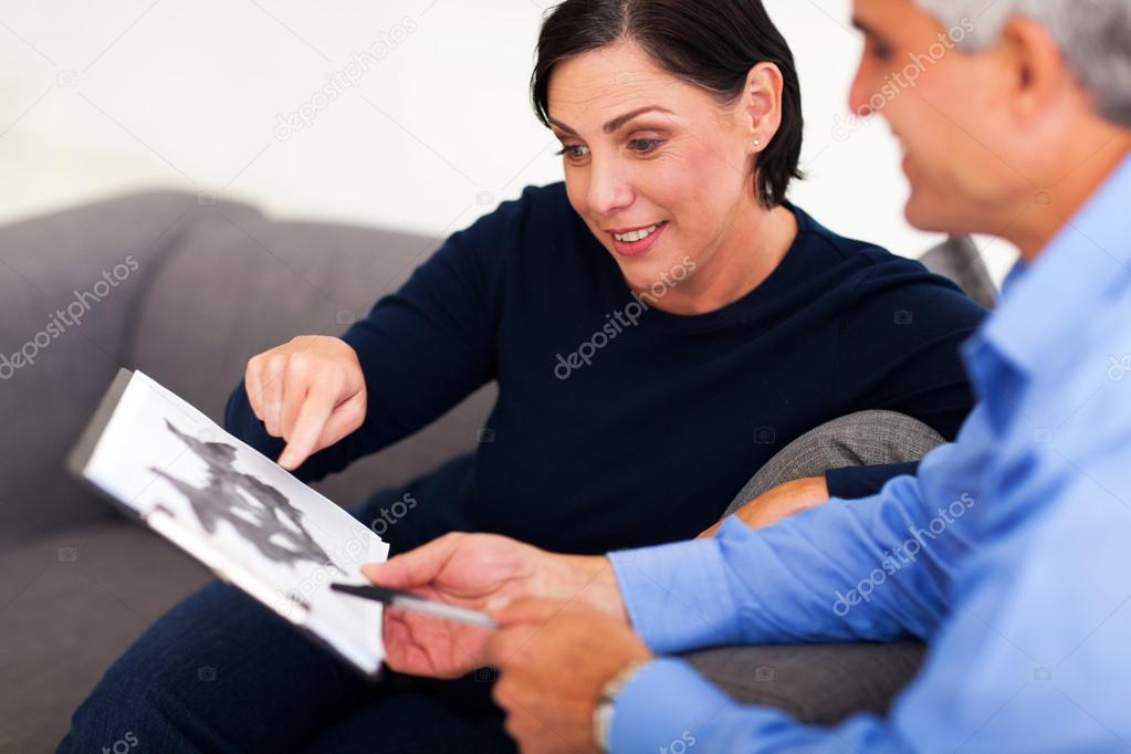 mature female patient looking at Rorschach inkblot with psycholo