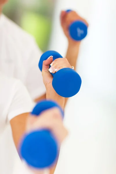 exercising with dumbbells