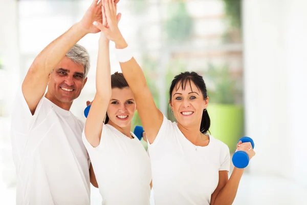 Family doing high five after exercising — Stock Photo, Image