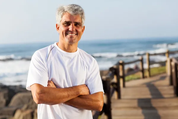 Active mid age man on the beach — Stock Photo, Image