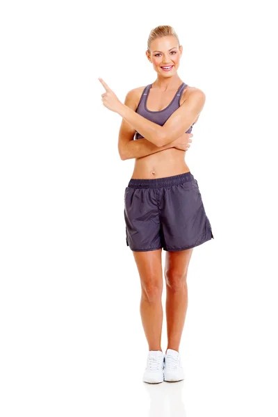 Young active woman pointing — Stock Photo, Image