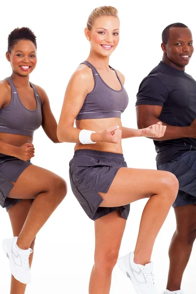 Caucasiano mulher exercitando com dois amigos — Fotografia de Stock