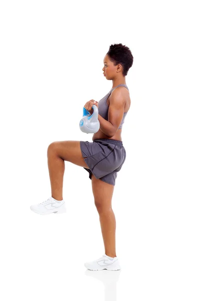 Afro american woman doing exercise with kettle bell Stock Image