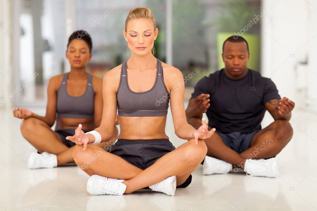 group of young meditating