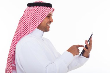 side view of arabian man using tablet computer clipart
