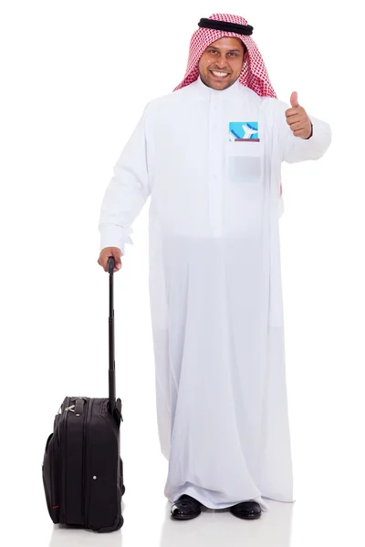 Арабский бизнесмен с багажом, показывающий большой палец вверх — стоковое фото