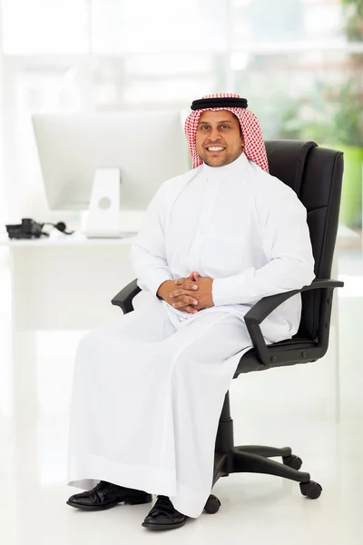 Middle eastern businessman sitting in office — Stock Photo, Image