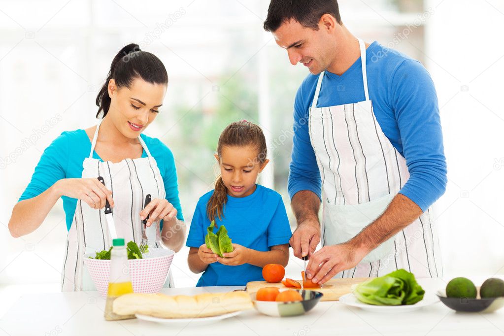 lovely family preparing food at home