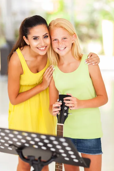 Music teacher with preteen girl after music lesson — Stock Photo, Image