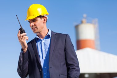construction manager using walkie talkie clipart