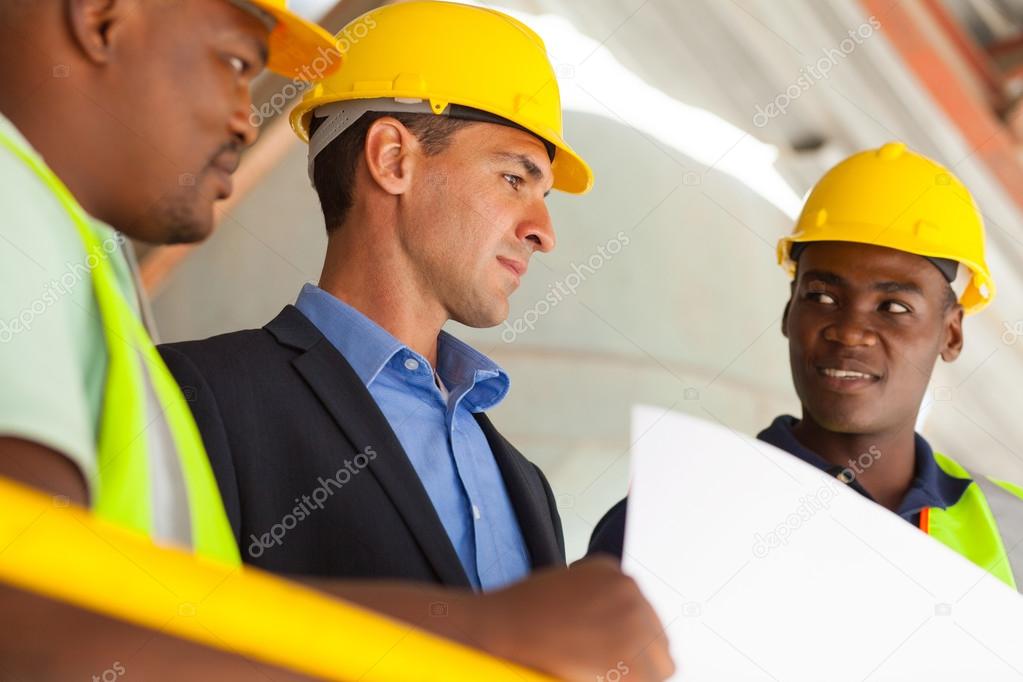 industrial manager and workers working on planning