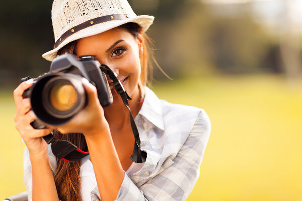 attractive young woman taking pictures
