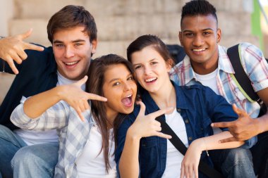 group of teenagers giving cool hand signs clipart