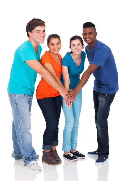 Gelukkig middelbare school studenten handen samen — Stockfoto