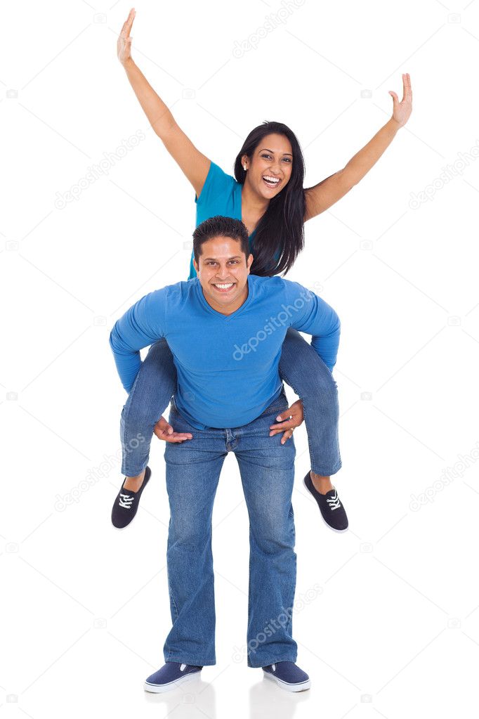 loving couple having fun with piggyback ride