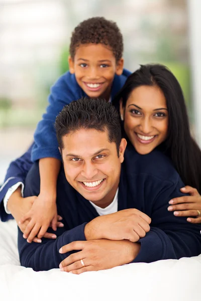 Adorable indian family pyramid on bed — Stock Photo, Image