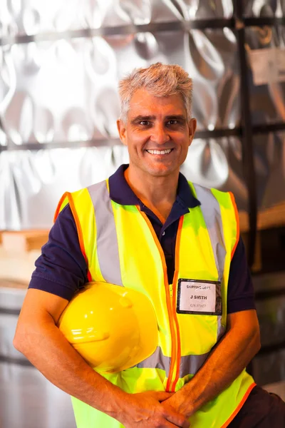 Senior shipping company worker in warehouse — Stock Photo, Image