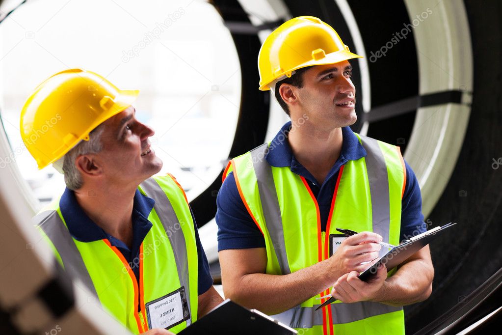 shipping company employees inspecting tires