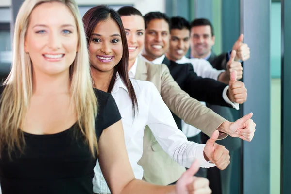Business team giving thumbs up — Stock Photo, Image