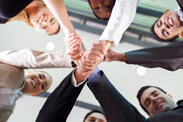 Underneath view of businesspeople handshaking