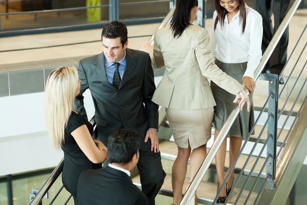 Group of office workers walking on stairs — Stock Photo, Image