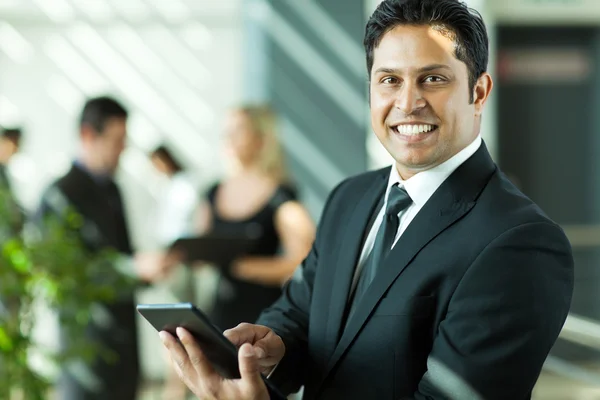 Young indian businessman working on tablet computer — Stock Photo, Image