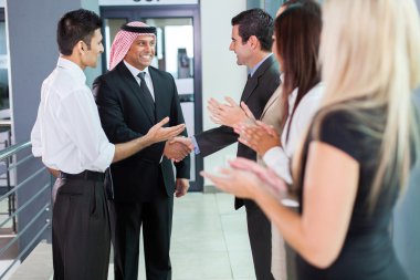 Translator introducing arabian businessman clipart
